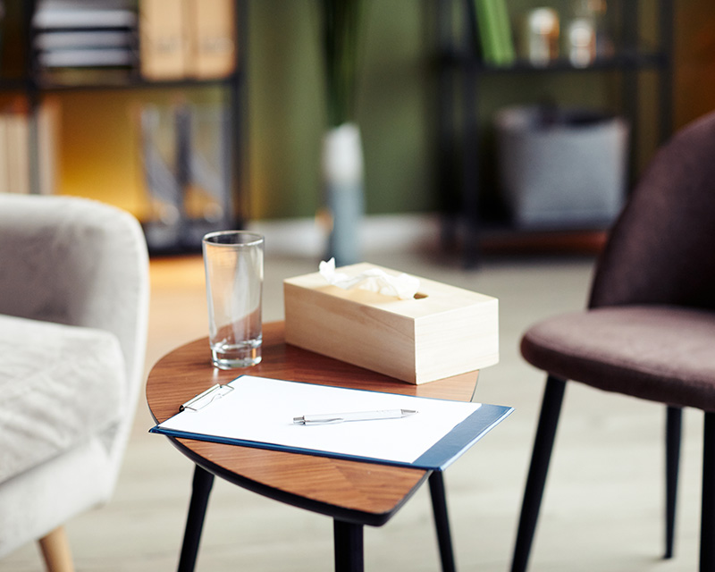 Two chairs with box of tissues