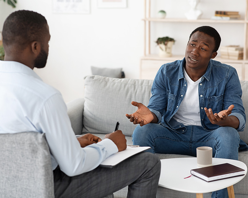 Black therapist in session with Black client