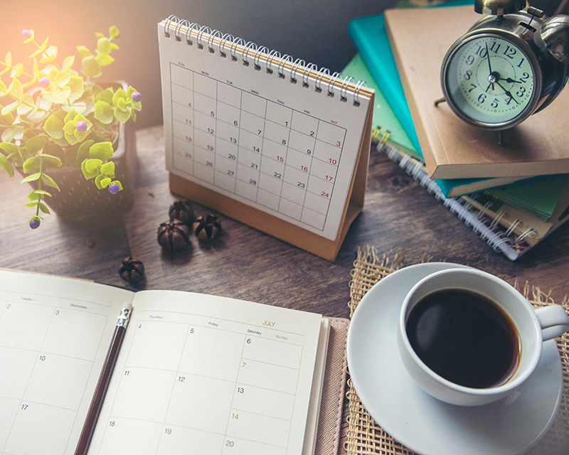 Nichole_Johnson_LMSW_therapist Calendar and cup of coffee and journal
