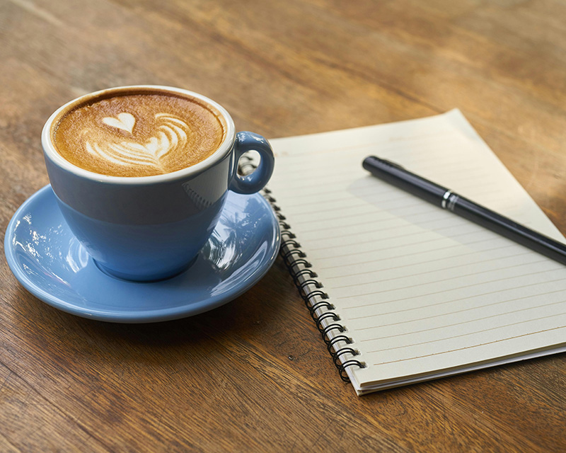 alysha_diaz_lynbrook Coffee cup and journal